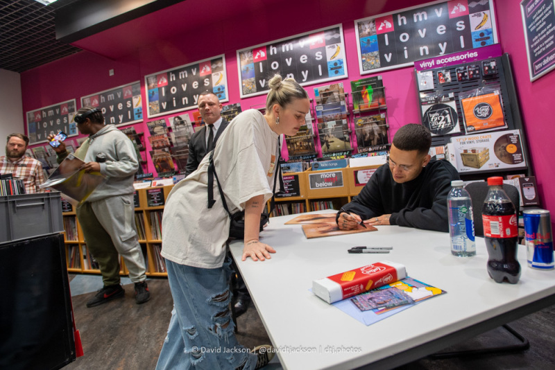 Anne-Marie getting slowthai to sign a copy of UGLY.