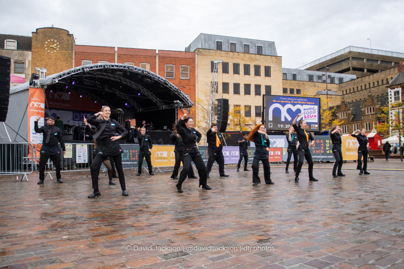 Staff from Royal & Derngate taking part in a flash mob at the Market Square in Northampton on Sunday, October 20, 2024, performing as part of a weekend of activities celebrating its official reopening. Photo by David Jackson.