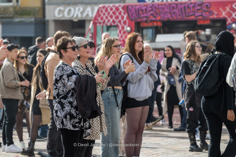 People enjoying acts performing on stage at the Market Square in Northampton on Saturday, October 19, 2024, as part of a weekend of activities celebrating its official reopening. Photo by David Jackson.