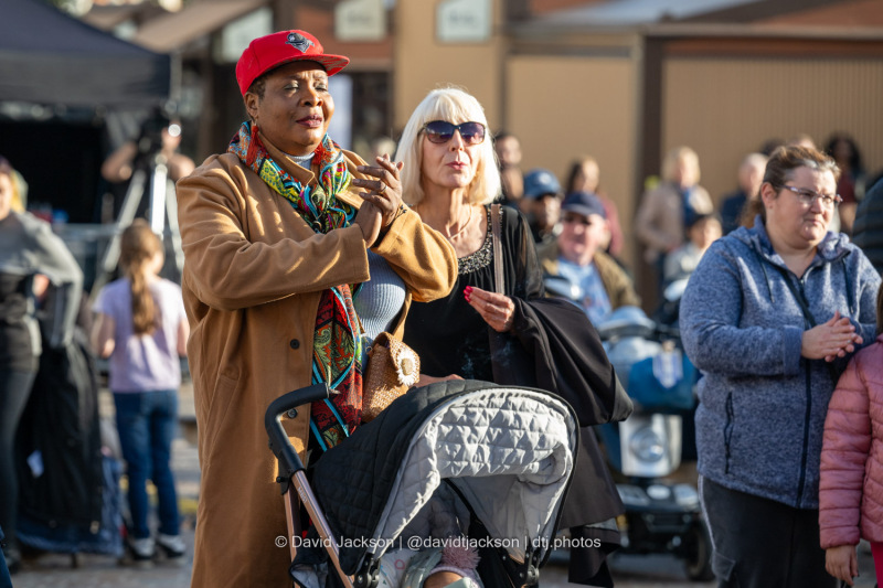 People enjoying acts performing on stage at the Market Square in Northampton on Saturday, October 19, 2024, as part of a weekend of activities celebrating its official reopening. Photo by David Jackson.