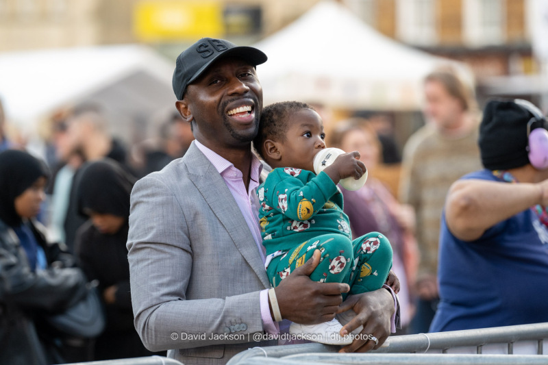 People enjoying acts performing on stage at the Market Square in Northampton on Saturday, October 19, 2024, as part of a weekend of activities celebrating its official reopening. Photo by David Jackson.