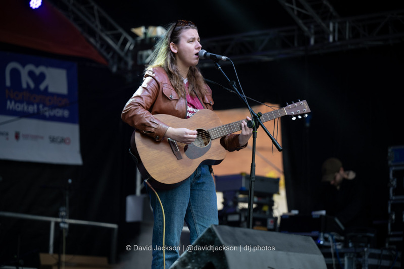 Hana Brooks on stage at the Market Square in Northampton on Sunday, October 20, 2024, performing as part of a weekend of activities celebrating its official reopening. Photo by David Jackson.
