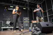 Kerrie Cosh from BBC Introducing in Northants & Three Counties and festival Director Tommy Gardner talking to the crowd ahead of headliners Unpeople. Photo by David Jackson.