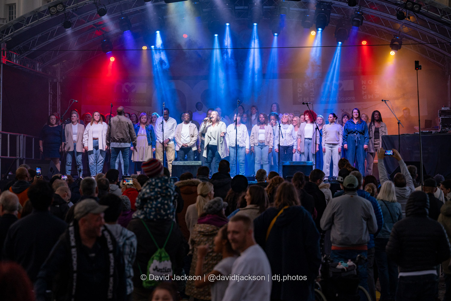 The Northants Sings Out Choir on stage at the Market Square in Northampton on Sunday, October 20, 2024, performing as part of a weekend of activities celebrating its official reopening. Photo by David Jackson.